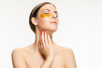 Image showing Beauty portrait of an attractive girl with a gold patch under the eye.