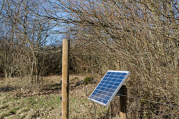 Image showing Solar panel by a fence