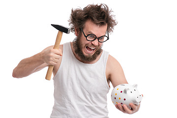 Image showing Crazy bearded man with piggy bank