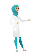 Image showing Young muslim doctor pointing to the side