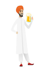 Image showing Cheerful hindu farmer drinking beer.