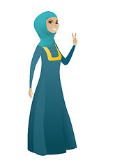 Image showing Muslim business woman showing victory gesture.