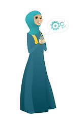 Image showing Muslim business woman holding a mobile phone.