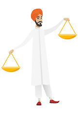 Image showing Hindu businessman holding balance scale.