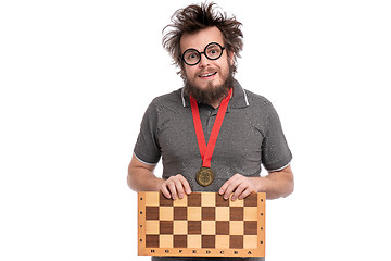 Image showing Crazy bearded man with Chess board