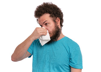 Image showing Crazy bearded man has runny nose