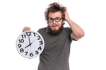 Image showing Crazy bearded man with big clock