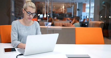 Image showing businesswoman using a laptop in startup office