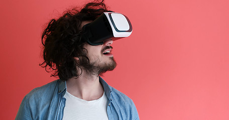 Image showing young man using VR headset glasses of virtual reality