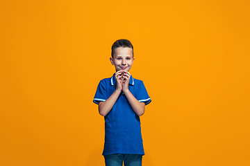 Image showing Young serious thoughtful teen boy. Doubt concept.