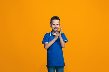 Image showing Young serious thoughtful teen boy. Doubt concept.