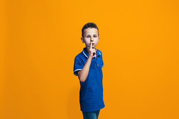 Image showing Young serious thoughtful teen boy. Doubt concept.