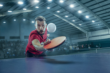 Image showing The table tennis player serving