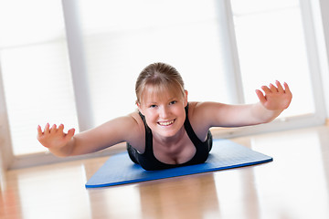 Image showing Girl does exercise to strengthen her back