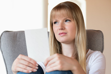 Image showing Sad girl holding photo