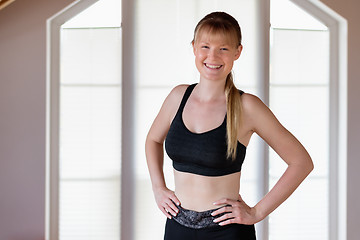 Image showing Girl doing squat exercises