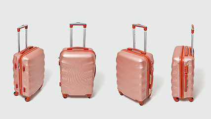 Image showing Set of modern brown travel suitcases presented on a gray background with copy space. Tourism concept.