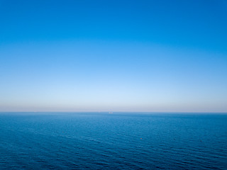 Image showing Natural scenery of blue sea or ocean with blue clear sky. Aerial view from drone. Seascape background, copy space.