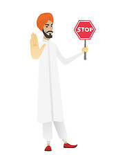 Image showing Hindu businessman holding stop road sign.