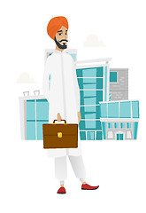 Image showing Hindu businessman holding briefcase.