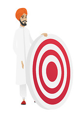 Image showing Young hindu businessman and dart board.