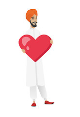Image showing Hindu businessman holding a big red heart.