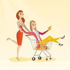 Image showing Couple of friends riding in shopping trolley.