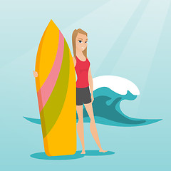 Image showing Young caucasian surfer holding a surfboard.