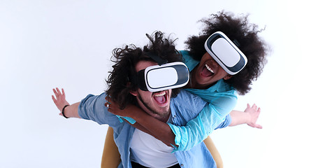 Image showing multiethnic couple getting experience using VR headset glasses