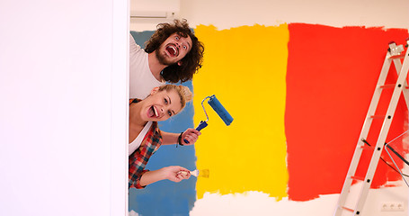 Image showing portrait of a couple painting interior wall