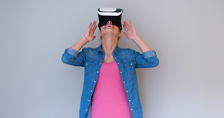 Image showing girl using VR headset glasses of virtual reality