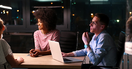 Image showing Multiethnic startup business team in night office