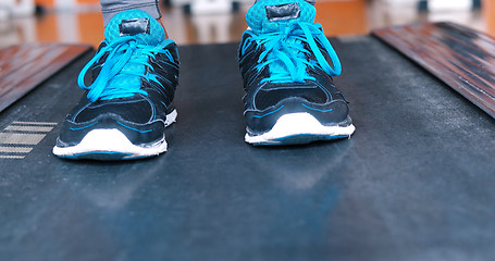 Image showing black female feet in sneakers