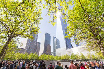 Image showing Tourists visiting 9 11 memorial park in downtown Manhattan, located on the site as the original World Trade Center.