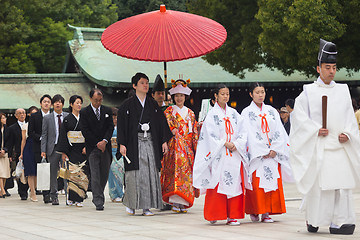 Image showing Young happy groom and bride during japanese traditional wedding ceremony at Meiji-jingu shrine in Tokyo, Japan on November 23, 2013.