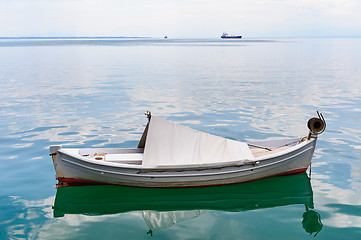 Image showing Small fishing boat at sea surface