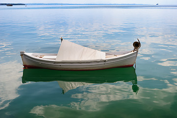 Image showing Small fishing boat at sea surface