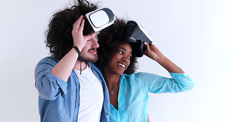 Image showing multiethnic couple getting experience using VR headset glasses