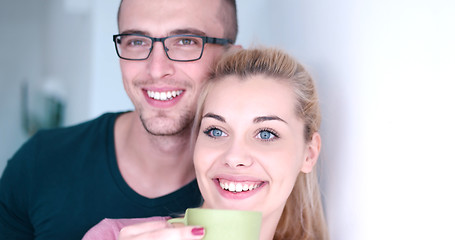 Image showing young couple enjoying morning coffee