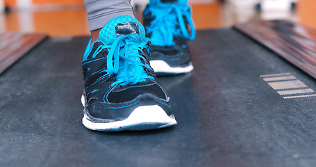 Image showing black female feet in sneakers