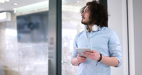 Image showing businessman using tablet computer