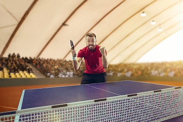 Image showing The table tennis player celebrating victory