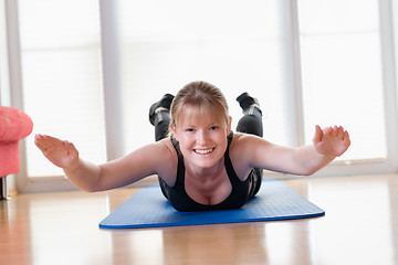 Image showing Girl does exercise to strengthen her back