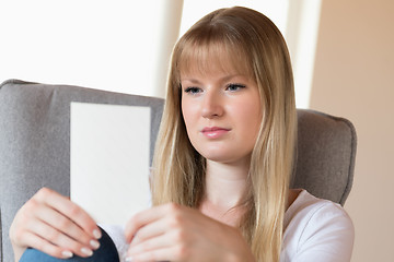 Image showing Sad girl holding photo