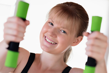 Image showing Girl doing dumbbell exercises