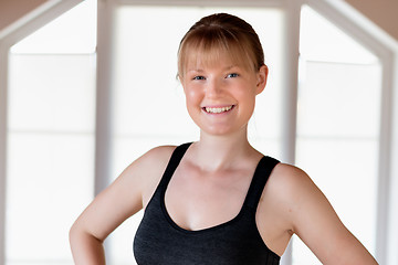 Image showing Girl doing squat exercises