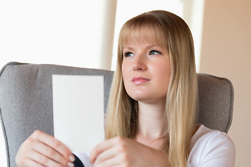 Image showing Sad girl holding photo