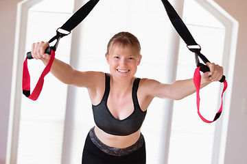 Image showing Girl in sling training