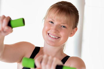 Image showing Girl doing dumbbell exercises