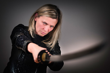 Image showing Female fighter with sword